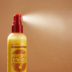 Après-shampoing sans rinçage à l'huile d'argan certifiée naturelle Creme of Nature pour la réparation et la protection des cheveux bouclés - Product Image 1