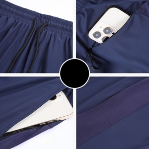 Venta caliente de malla con bolsillos con cremallera de poliéster para hombre corriendo deportes de compresión pantalones cortos atléticos - Product Image 4