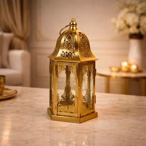 Lanterne marocaine en métal doré de qualité supérieure avec des panneaux en verre à découpes complexes, lumière de bougie chaleureuse pour une décoration intérieure élégante et des cadeaux - Product Image 1