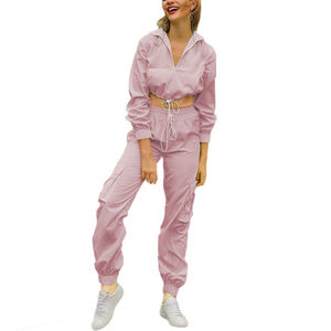 Conjunto de diseñador de lujo: Chaqueta cortavientos de manga raglán y pantalón de chándal para mujer, ideal para el verano. - Product Image 2