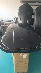 Caja de techo de coche de nuevo diseño 2025, accesorios, techo de equipaje de carga, caja de viaje de almacenamiento grande, caja de portaequipajes de techo de coche de gran capacidad ABS