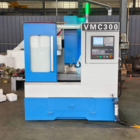 Centre d'usinage vertical CNC VMC300 3 axes, 4 axes pour le traitement des métaux