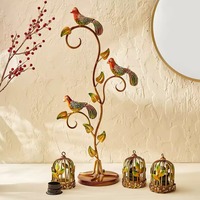 Bougeoir accrocheur avec cage suspendue et bougeoir oiseau bourdonnement berceaux lumière comme chuchotement de chaleur sculpté dans l'art
