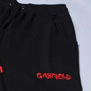 Pantalones de Pijama Evolve X para Mujer, de Algodón Súper Suave con Estampado de Garfield, Estilo Relajado con Cierre de Cordón y Bolsillos - Product Image 1