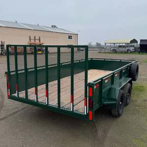 À vendre : Remorque utilitaire robuste à double essieu de 7'x14' avec côtés de 2' et porte arrière en filet, couleur verte - Product Image 1
