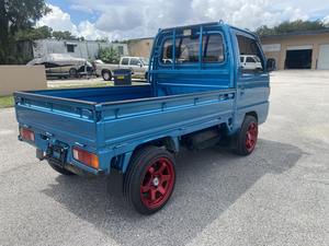 Honda Acty d'occasion, moteur turbo, pneus R15, sièges en cuir, couleur foncée, 100% en parfait état de marche, garantie sans accident. - Product Image 3