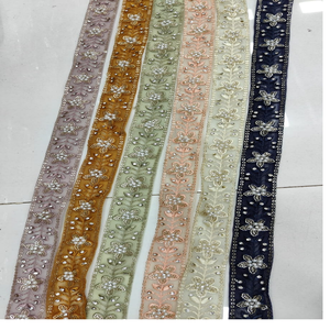 Cintas y cordones bordados a máquina hechos a medida en varios diseños y colores para vestidos de novia con borde de lentejuelas en ambos lados. - Product Image 1