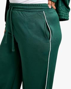 Pantalones de chándal de mujer apilados a rayas reflectantes retro personalizados OEM, pantalones de chándal de pierna ancha de nailon causal cortavientos lateral estilo cordón - Product Image 2