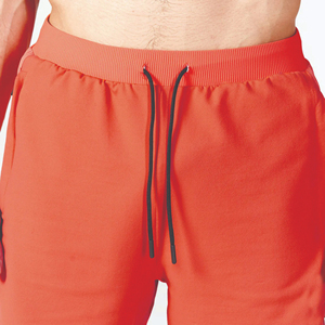 Pantalones cortos flexibles acanalados de tela de rendimiento ligero naranja con cintura de tela acanalada y dobladillo con puños - Product Image 5