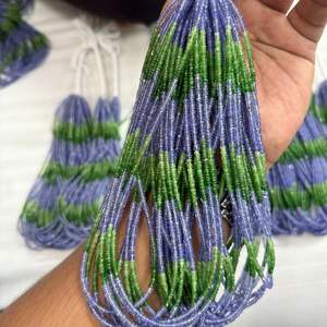 Mezcla de Tanzanita y Tsavorita de la Mejor Calidad, Cuentas Redondas Facetadas de 2 mm a 3,5 mm con Más de 50 Años de Experiencia en la Fabricación de Joyas - Product Image 1