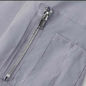 Chaqueta Acolchada Cortavientos Unisex de Invierno con Tela de Lona, Estilo Urbano, Cuello Alto y Logotipo Frontal - Product Image 5