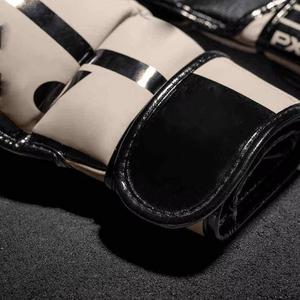 ถุงมือชกมวยแบบมืออาชีพ 16 ออนซ์ ทำจาก PU  จับกระชับมือ  ความหนาแน่นสูง  ระบายอากาศได้ดี  กันน้ำ  เหมาะสำหรับฝึกซ้อมซานด้า  MMA คิกบ็อกซิ่ง - Product Image 3