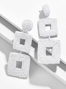Boucles d'oreilles pendantes en perles de style cerceau brodé - Product Image 1