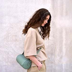 Black Genuine <b>Leather</b> Barrel <b>Bag</b> With Ruffles Buckle Closure Minimalist Design Unisex Daily Use - Product Image 5