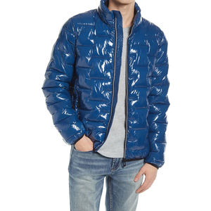 Chaqueta acolchada de poliéster 100% impermeable en producto terminado de temporada de invierno azul oscuro - Product Image 1