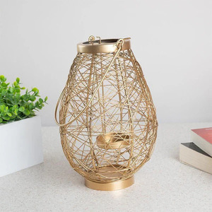 Elegant Gold Wire Lantern Stylish <b>Lighting</b> for Any <b>Space</b> Gold Wire Lantern Perfect for Creating a Cozy Warm Glow - Product Image 1