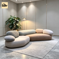 Ensemble de canapés modulaires incurvés en bouclette personnalisés, design Pebble, dossier coussin, sans accoudoirs, pour salon, villa, hôtel, zone de réception