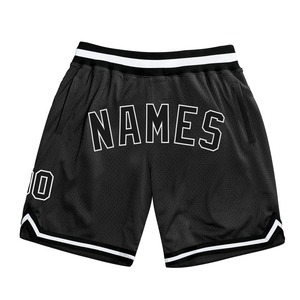 Pantalones cortos de baloncesto para hombre personalizados de malla atlética con diseño de poliéster y estrellas sublimadas en blanco y negro - Product Image 1