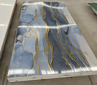 Panneau mural en PVC effet marbre noir de luxe MORLENX avec veinage doré, finition brillante, pour la décoration intérieure d'hôtels et de villas