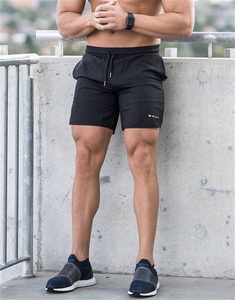 Directo de fábrica Pantalones cortos de gimnasio de verano Fresco y transpirable Bordado personalizado Loose Fit Patrón sólido para hombres - Product Image 5