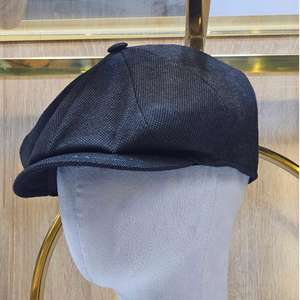Esta es una gorra de estilo Newsboy marrón con un acabado texturizado, potencialmente de algodón y lino. - Product Image 6