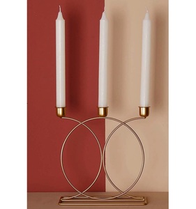 Minimalist <b>Brass</b> Candle <b>Holder</b> with 4-Candle Design and Curved Arms on Circular Base Modern Accent for Dining & Festive Decor - Product Image 5