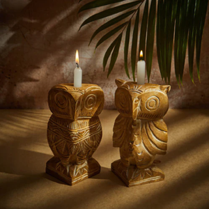 Hand-carved wooden owl-<b>shaped</b> taper <b>candle</b> holders with detailed feather and facial carvings, available at wholesale prices. - Product Image 1