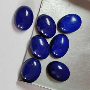 Vente en gros de pierres précieuses naturelles Lapis Lazuli 7X9mm Cabochon bleu lisse à dos plat et ovale pour bijoux Pierres de Lapis en vrac - Product Image 1