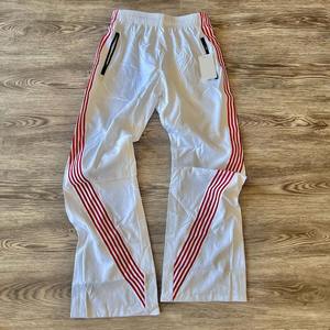 Wholesale Custom Streetwear Baggy Spandex Wide Leg Waterproof Stripe Track Windbreaker Pants <b>Nylon</b> for <b>Men</b> - Product Image 2