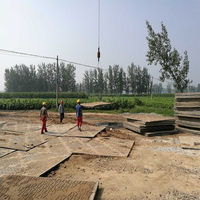 Tapis de protection au sol robuste pour le transport de composants de turbines d'éoliennes sur site d'installation, pour grue et plateforme de sol.