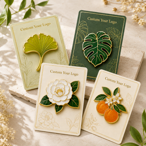Badges de revers en métal personnalisés en émail dur, plaqués or, motifs botaniques : Ginkgo, Monstera, Camélia, Agrumes - Product Image 1