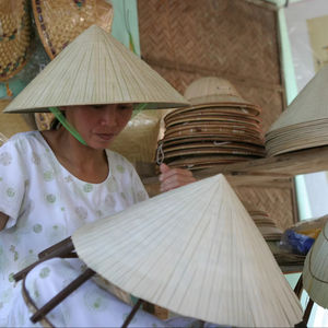 Wholesales Bamboo Leaf Conical Hats Durable Lightweight And Artistic For Both Decoration And Practical Use From Vietnam by 99GD - Product Image 1