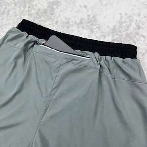 กางเกงขาสั้นออกกำลังกายผู้ชายแบบ 2 in 1 ระบายอากาศได้ดี ผ้าสองชั้น มีกระเป๋า แห้งเร็ว เหมาะสำหรับวิ่ง ฟิตเนส เล่นกีฬา และออกกำลังกายในยิม - Product Image 4