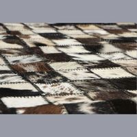 Tapis artisanal haut de gamme en patchwork de cuir de vache pour salon et chambre à coucher