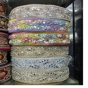 Fait sur mesure dans des options multicolores avec des perles et des lacets et des couleurs brodés à la machine pour les robes de mariée. - Product Image 1