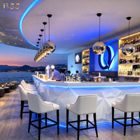 Meubles de bar LED modernes, sur mesure, en forme de L, en Corian blanc, pour bars commerciaux, hôtels, lounges, boîtes de nuit, restaurants