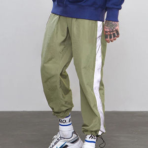 Veste coupe-vent unisexe tendance en nylon, coupe régulière, poches latérales à fermeture éclair, pantalon en nylon ajusté, séchage rapide, bas ample - Product Image 3