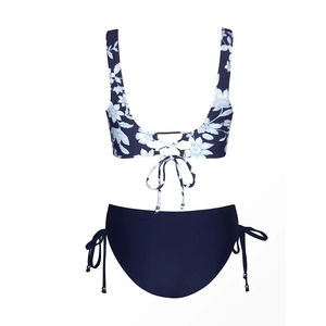 ชุดแทนกินีผู้หญิง ผลิตในปากีสถาน ลายดอกไม้ดีไซน์เฉพาะ ระบายอากาศได้ดี พร้อมโลโก้ด้านหน้า เหมาะสำหรับกิจกรรมกลางแจ้ง ชุด 2 ชิ้น ผ้าโพลีเอสเตอร์ - Product Image 6