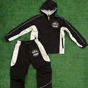 Venta al por mayor nuevo chándal personalizado de nailon chándal con cremallera traje cortavientos chaqueta con cremallera conjunto con capucha 100% conjunto corto de nailon - Product Image 6