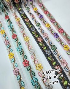 Rubans et lacets brodés à la machine sur mesure dans divers modèles et en sept couleurs pour les robes de mariée sur tissu net. - Product Image 2