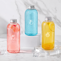 Bouteille en plastique ronde transparente PET personnalisée de 500 ml avec couvercle pour l'emballage du vin et la distribution en gros de boissons