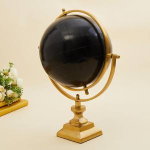 Table Accent with Stand is shown It is a decorative item featuring a black <b>globe</b> with golden accents and a stand - Product Image 1
