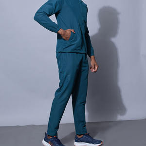 Survêtement athlétique bleu sarcelle pour homme, veste zippée à col montant avec motif géométrique sur les épaules et pantalon de jogging ajusté assorti, vêtements de sport - Product Image 4