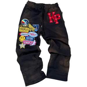 กางเกงวอร์มผู้ชายลายกราฟิก ทรงหลวม ผ้าฟลีซ สไตล์สตรีทแวร์ ดีไซน์โดดเด่น ใส่สบายๆ สำหรับพักผ่อนหรือใส่ทุกวัน - Product Image 1