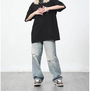 กางเกงยีนส์ผู้ชายทรงเฟลร์แบบวินเทจฟอกสี ขาดเซอร์ๆ สไตล์ดิสเทรส รูขาดๆ คุณภาพดี รับผลิตแบบ OEM ขายส่ง - Product Image 3