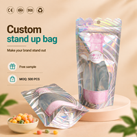 Sachet refermable transparent personnalisé avec fenêtre holographique et couche métallisée pour l'emballage de snacks