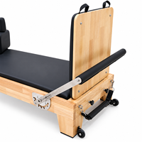 Machine de Pilates Reformer en bois de chêne de haute qualité, conçue pour les studios de Pilates à domicile et les équipements de fitness
