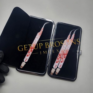 GETUP BROSONS IMPEX Nouvelle pince à cils incurvée en acier inoxydable durable de 10 mm avec pointe dentelée et lisse pour une prise parfaite, style Halloween - Product Image 1