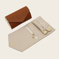 Nouveau voyage de luxe en cuir PU bijoux sacs de rangement organisateur de voyage rouleau pour collier Bracelet boucles d'oreilles anneau avec Logo personnalisé