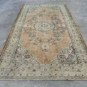 Vintage Turkish Rug 5.4x9.1 ft, <b>Brown</b> Large Animal Print <b>Wool</b> Rug - Product Image 1